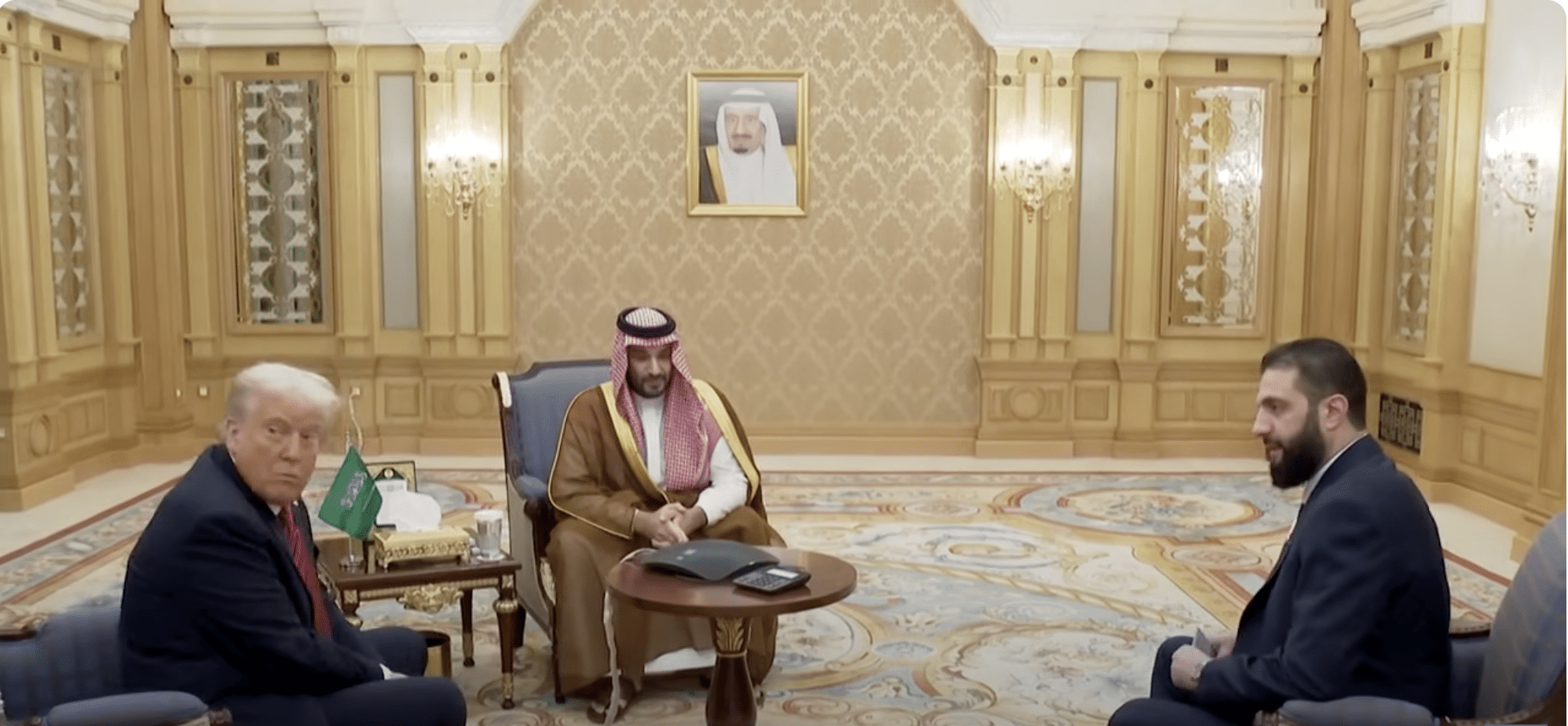 Headline says Trump’s photo with Syrian President al-Sharaa symbolizes “New World Order”